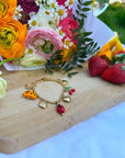 Bracelet breloque avec charms fruités et ensoleillés