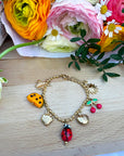 Bracelet breloque avec charms fruités et ensoleillés