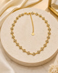 Collier doré avec fleurs argentés 100% inoxydable