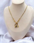 Collier Toluca doré neuf avec 2 charms