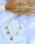 Collier Zanzibar avec charmes en coeur doré
